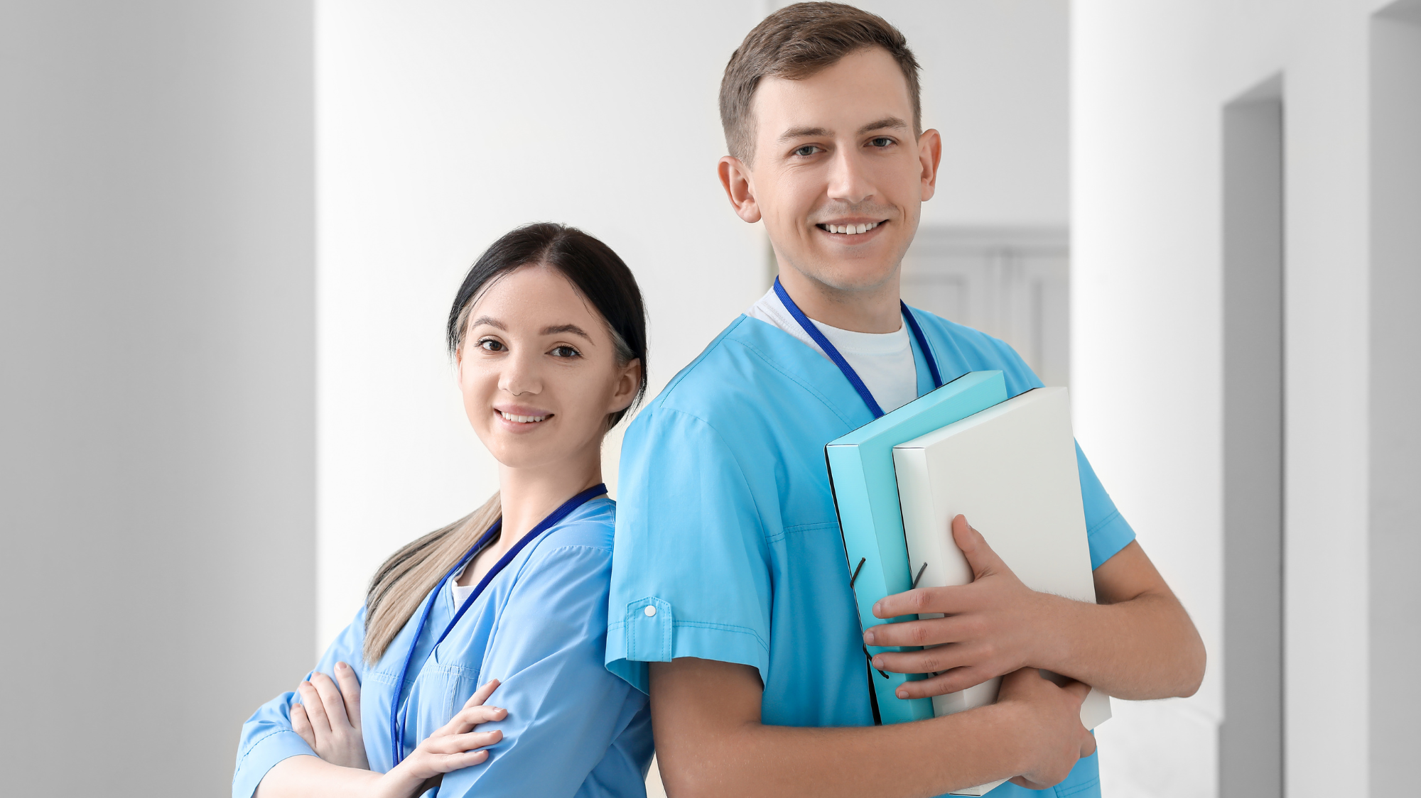 Skilled orthodontic assistants smiling after effective orthodontic training and onboarding